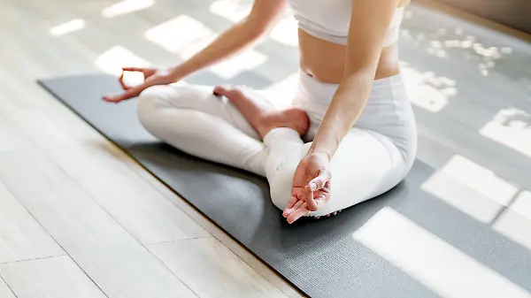 Fitness woman concentrate meditation yoga in studio. .