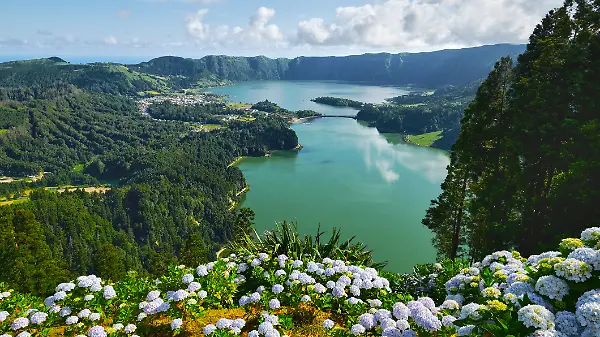 
Picturesque view of Sete Cidades in Azores, Sao Miguel. Volcanic craters and stunning lakes at sunny day. Ponta Delgada, Portugal. Natural wonders, landmarks and tourist attractions concept