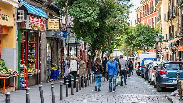 Madrid / Spain - October 19, 2019: People wander the popular Lavapies neighborhood in central Madrid, known for its great nightlife.