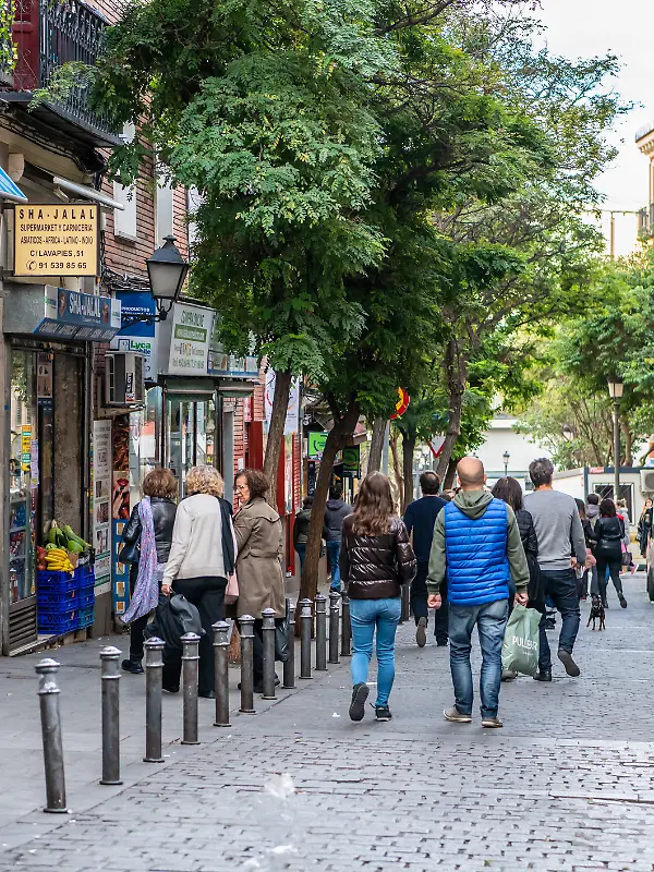Madrid / Spain - October 19, 2019: People wander the popular Lavapies neighborhood in central Madrid, known for its great nightlife.